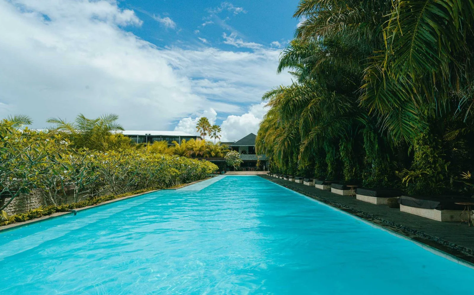 Long pool and tropical landscape at the existing Bali campus